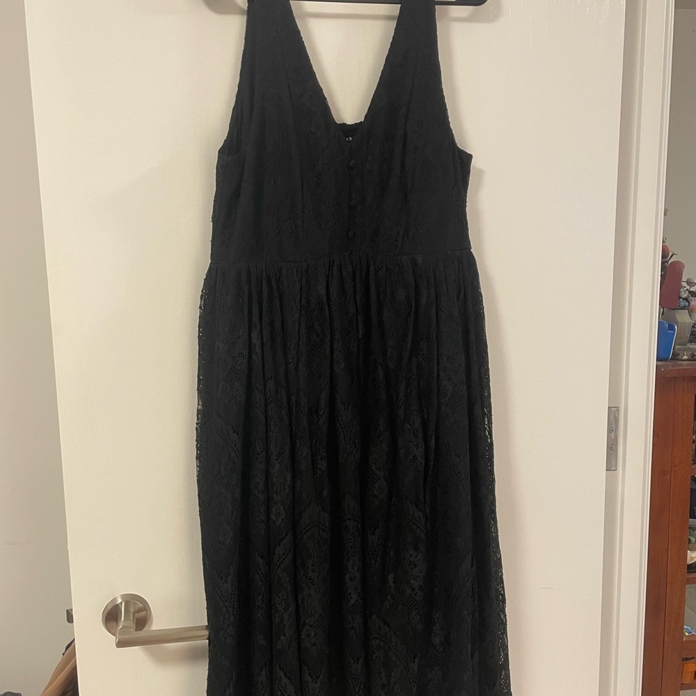 Torrid Elegant Black Dress with Lace Detail and Flowy Skirt